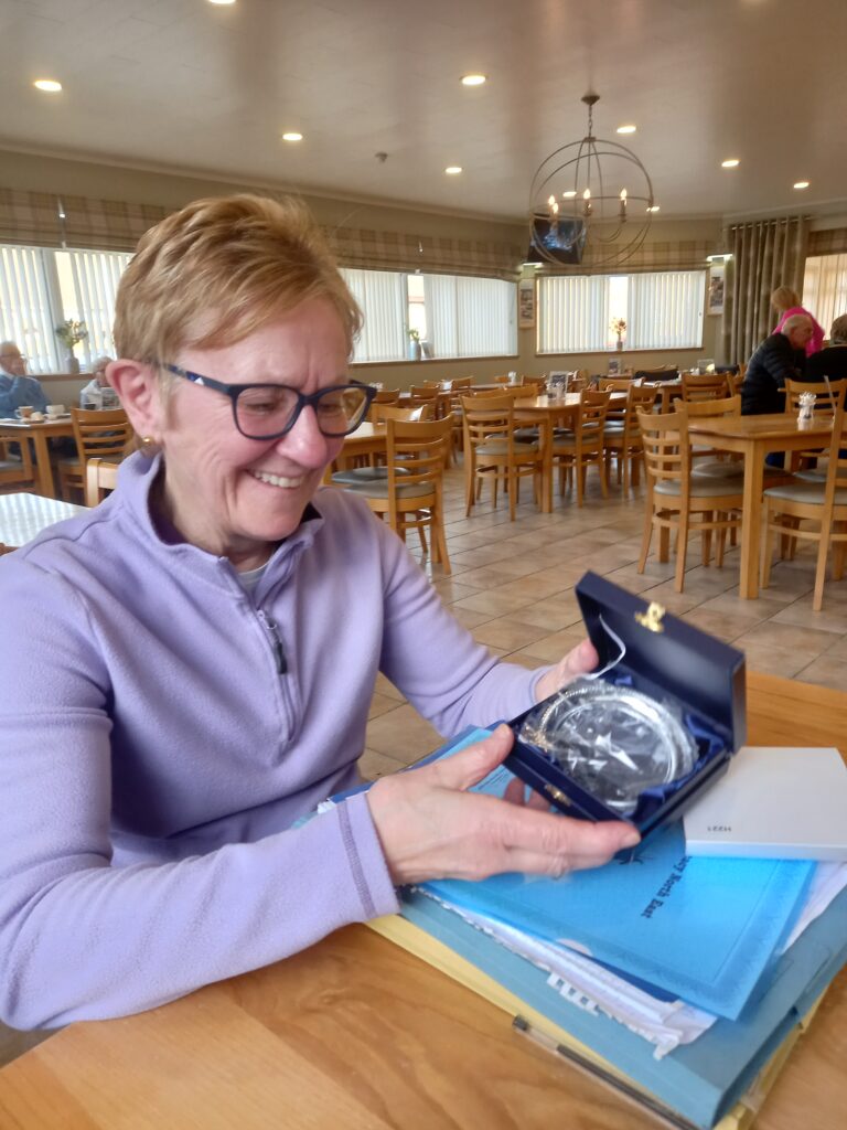 Carolyn Slessor receiving an award for 3 years service as a Community Advocate