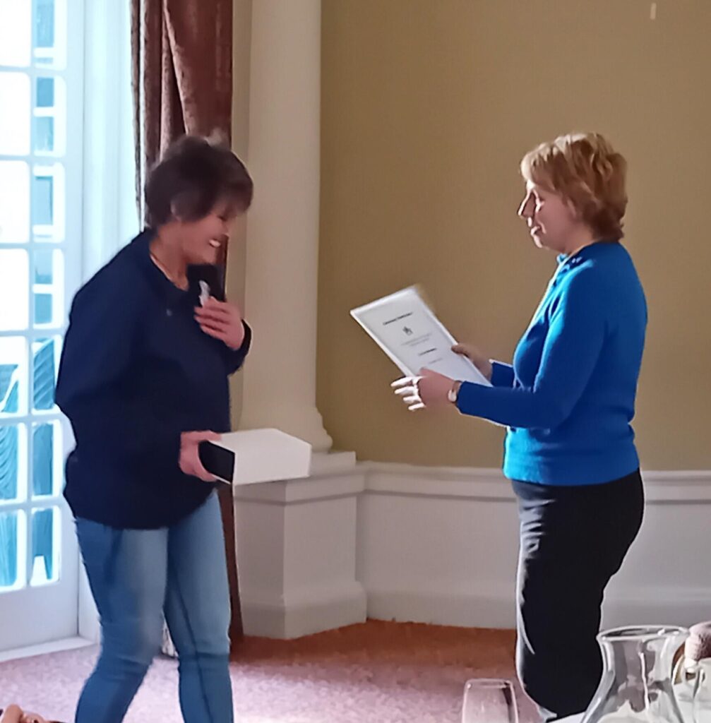 Lorna Paterson receiving an award for 10 years service as a Community Advocate